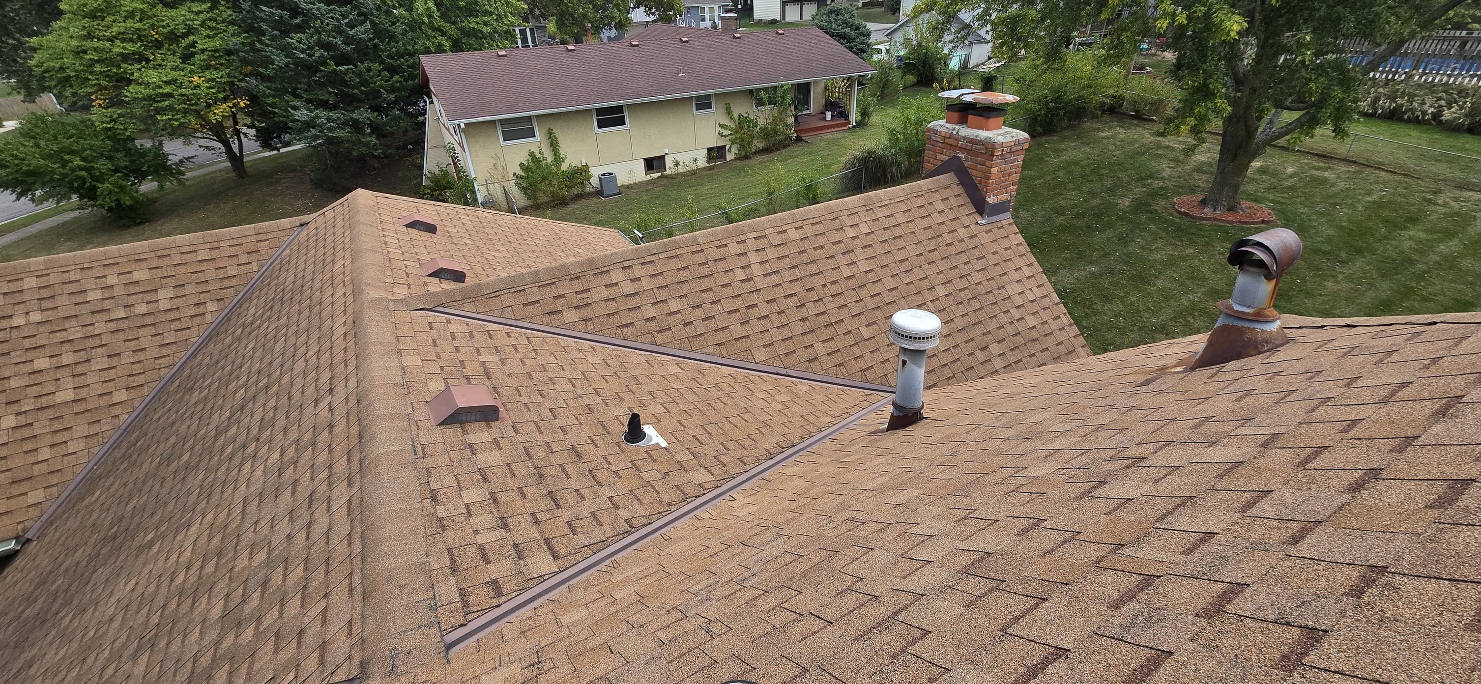 Aging roof reshingle close-up aerial by Brown Roofing LLC
